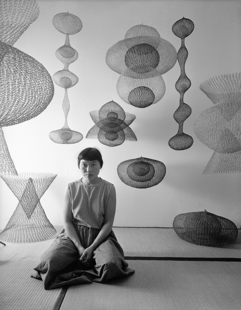 The American sculptor Ruth Asawa with her work, 1954.