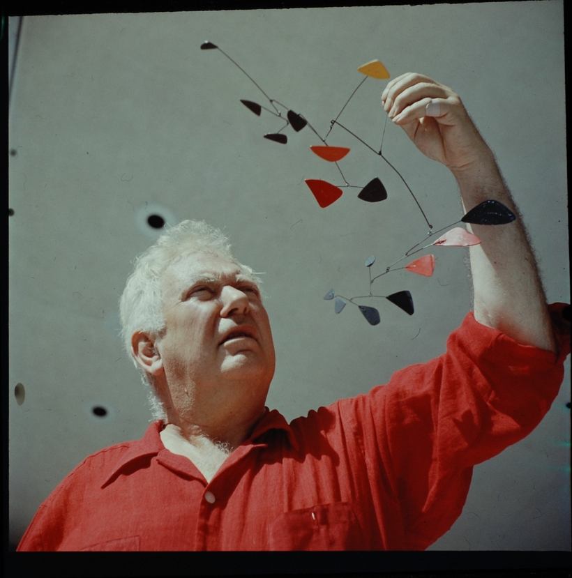 Alexander Calder, with his sculpture Flight, 1957.